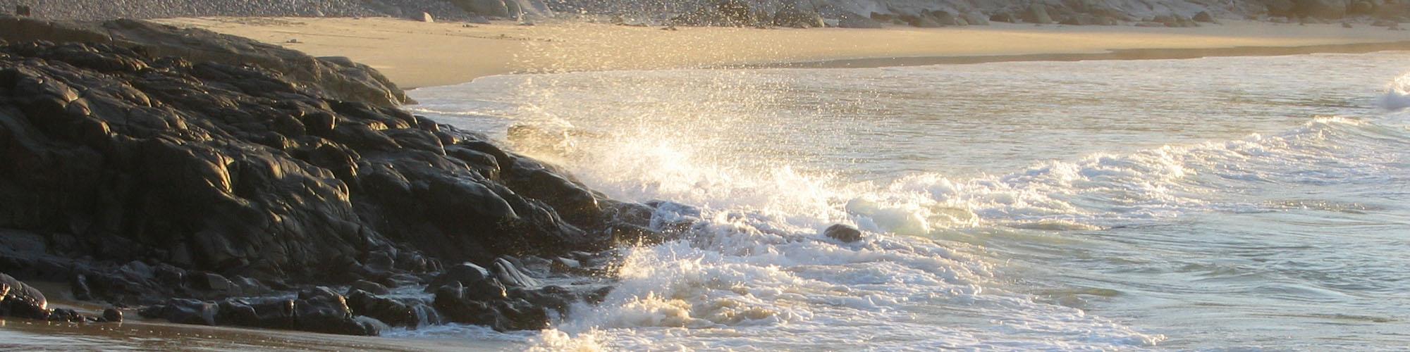 waves splashing up against rock